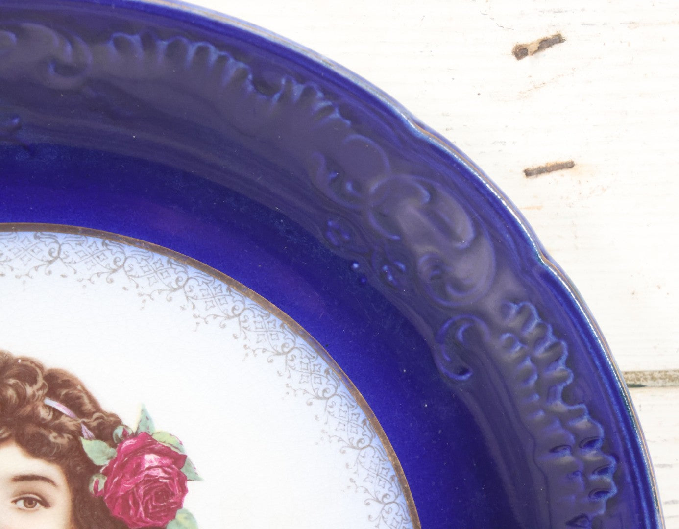 Lot 082 - Antique Decorative Transferware Plate With Blue Rim Featuring Pretty Woman With Long Brown Hair And Rose After G. Bonfits, By Royal La Belle, Wheeling Potteries Co., With Wire Hanger, 13" Diameter