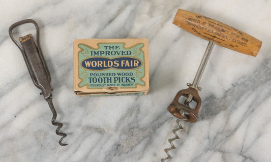 Lot 091 - Vintage And Antique 3 Item Bar Related Grouping Including Corkscrew From Providence Brewing Company, Bottle Opening Tool From Green River Whiskey, And Box Of New Old Stock N.O.S. World's Fair Toothpicks