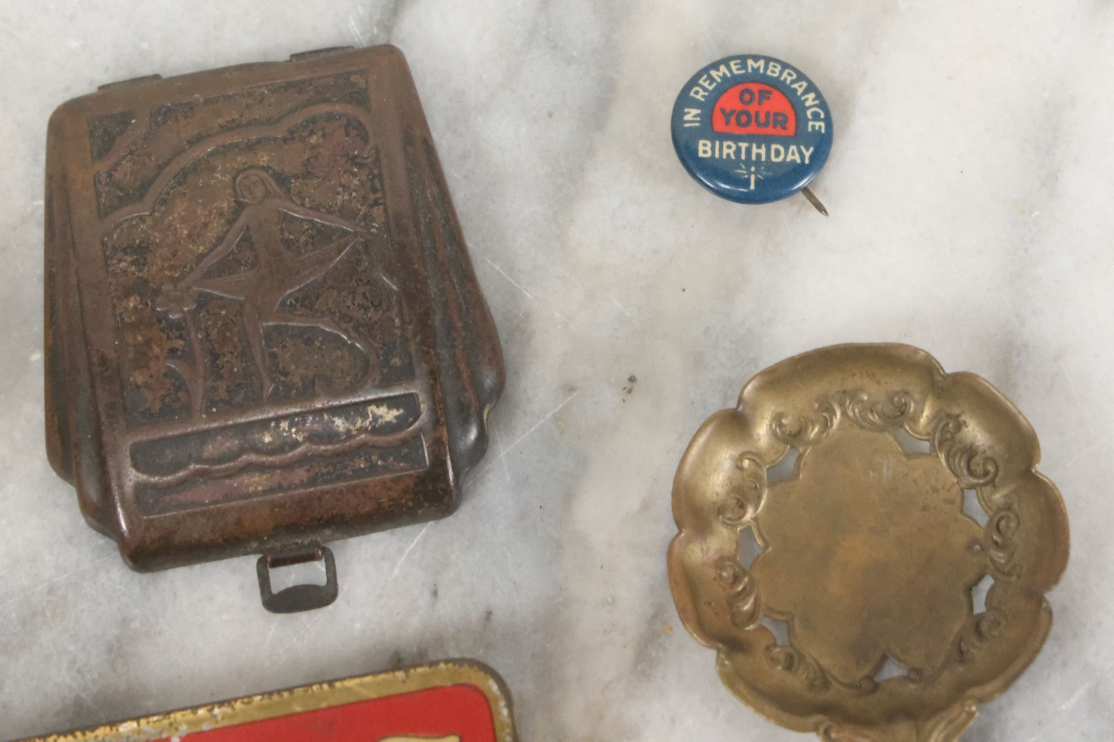 Lot 093 - Antique 5 Item Metals Grouping Including "Mother" Perfume Bottle Top, King Edward Vii & Queen Alexandra Commemorative Tin, Nude Woman Art Deco Fragment, First Birthday Pin, And Teaspoon