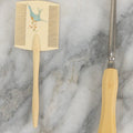 Lot 095 - Pair Of Antique Celluloid Dresser Items, Including Baby Comb With Painted Bluebird And Corset Hook