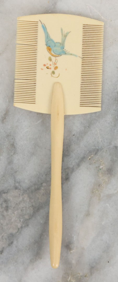 Lot 095 - Pair Of Antique Celluloid Dresser Items, Including Baby Comb With Painted Bluebird And Corset Hook