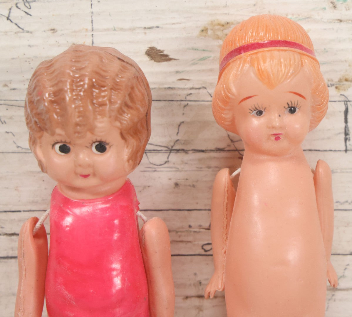 Lot 096 - Pair Of Vintage Celluloid Flapper Dolls, Made In Japan, One With Pink Headband And One With Pink Swimsuit
