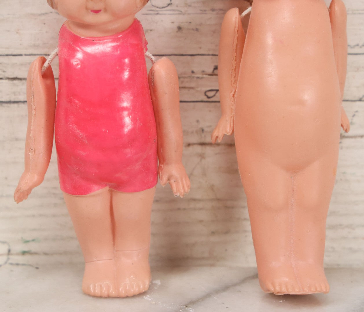 Lot 096 - Pair Of Vintage Celluloid Flapper Dolls, Made In Japan, One With Pink Headband And One With Pink Swimsuit
