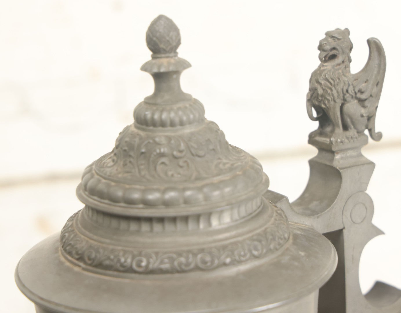 Lot 002 - Antique German Pewter Stein With Eagle, Griffin, And Cherub Motifs, Hinged Lid, Overall Height 14-1/4", Base 6-3/8" Diameter
