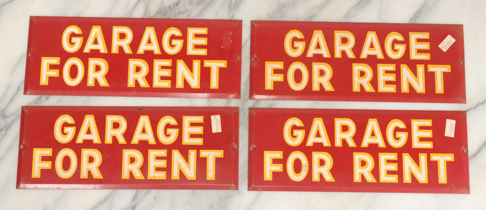 Lot 017 - Grouping Of Four Vintage Red "Garage For Rent" Tin Tacker Sign With Smaltz Lettering, White Letters With Yellow Outlines, 9-1/4" x 3-1/2"