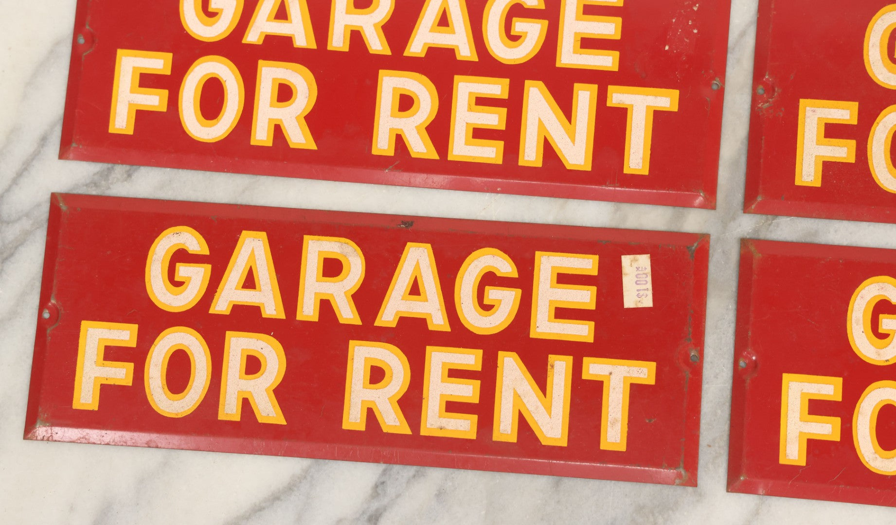 Lot 017 - Grouping Of Four Vintage Red "Garage For Rent" Tin Tacker Sign With Smaltz Lettering, White Letters With Yellow Outlines, 9-1/4" x 3-1/2"