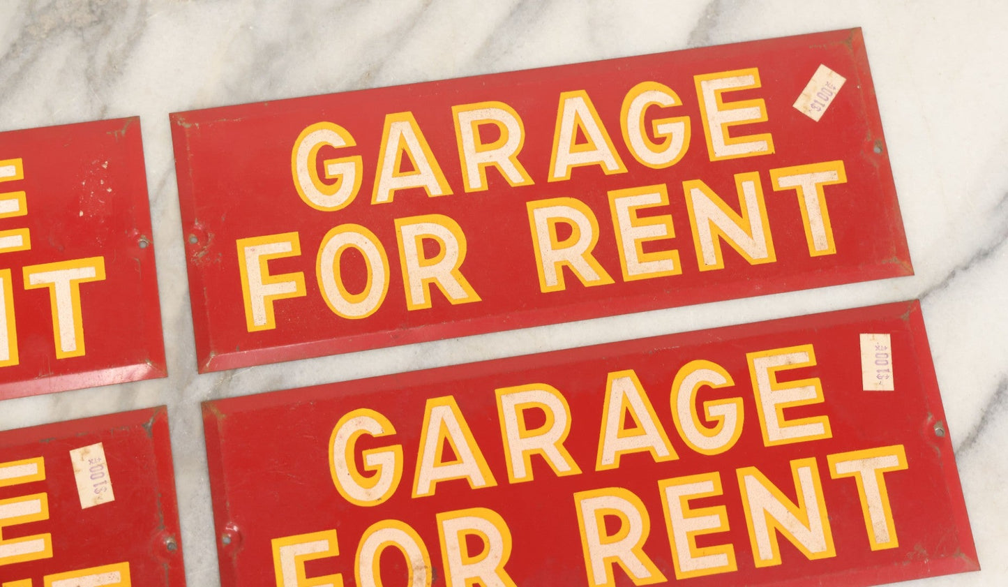 Lot 017 - Grouping Of Four Vintage Red "Garage For Rent" Tin Tacker Sign With Smaltz Lettering, White Letters With Yellow Outlines, 9-1/4" x 3-1/2"