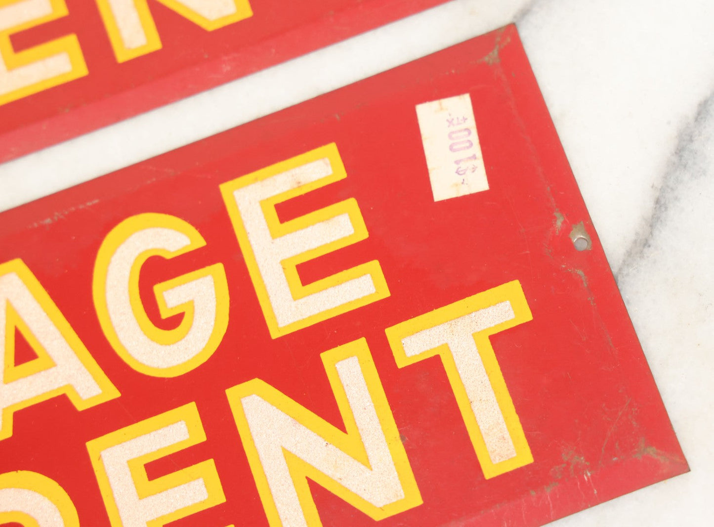 Lot 017 - Grouping Of Four Vintage Red "Garage For Rent" Tin Tacker Sign With Smaltz Lettering, White Letters With Yellow Outlines, 9-1/4" x 3-1/2"