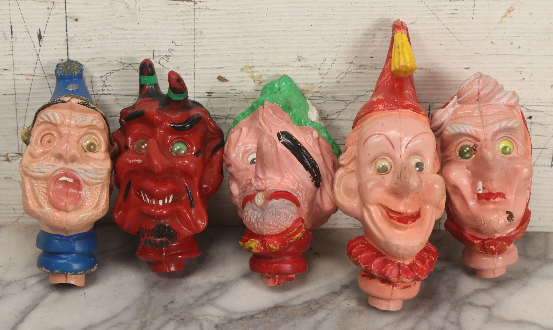 Lot 029 - Grouping Of Five Vintage Punch And Judy Style Rubber Puppet Heads Including Devil, Pirate, Cop, And Others
