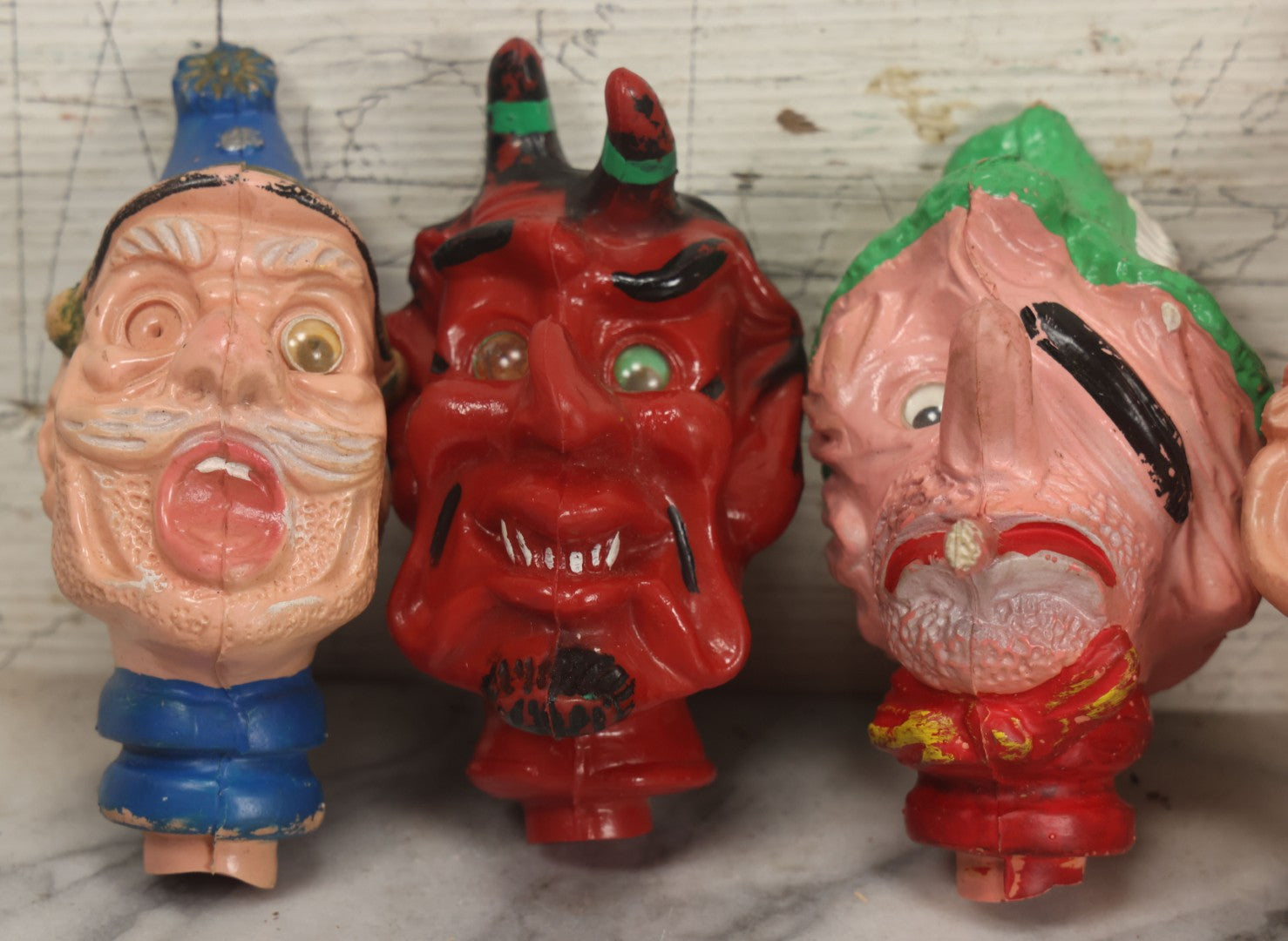 Lot 029 - Grouping Of Five Vintage Punch And Judy Style Rubber Puppet Heads Including Devil, Pirate, Cop, And Others