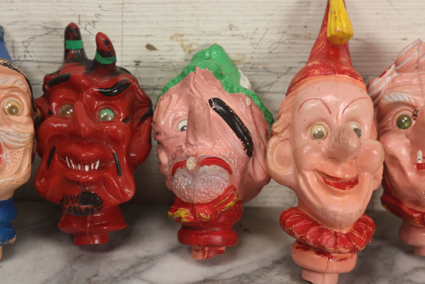 Lot 029 - Grouping Of Five Vintage Punch And Judy Style Rubber Puppet Heads Including Devil, Pirate, Cop, And Others
