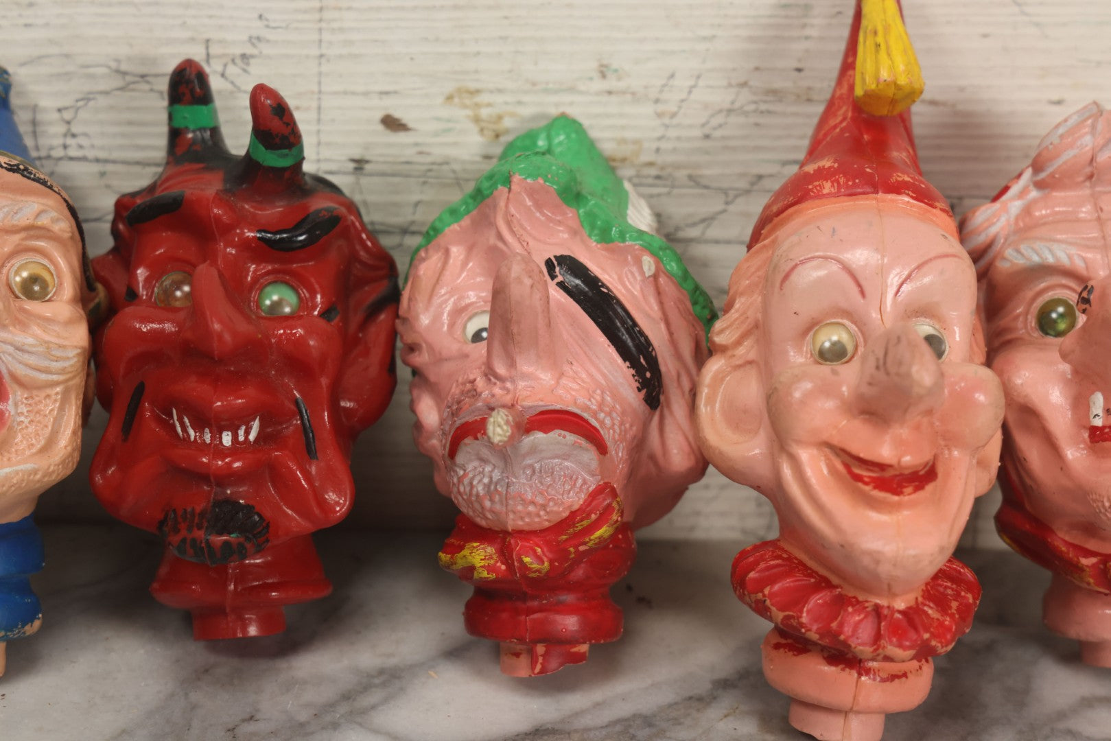 Lot 029 - Grouping Of Five Vintage Punch And Judy Style Rubber Puppet Heads Including Devil, Pirate, Cop, And Others