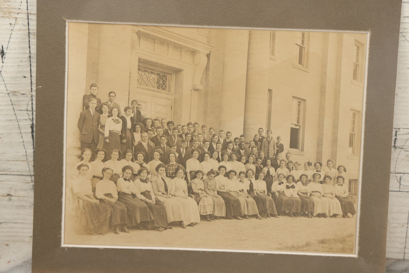 Lot 058 - Antique Boarded Photograph Of A High School Class Posing On The Steps Of Their School, Shrink Wrapped With Mat
