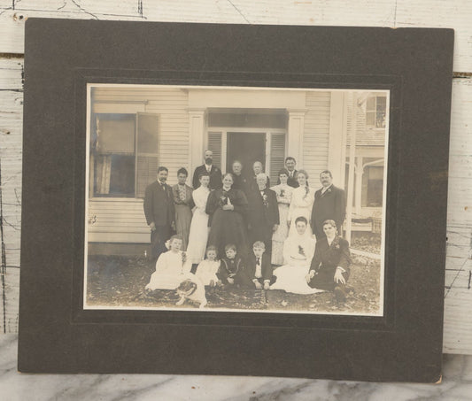 Lot 061 - Antique Boarded Photograph Of Several Generations Of A Family Posing Outside Of Their Home, With Pitbull Dog In Photo