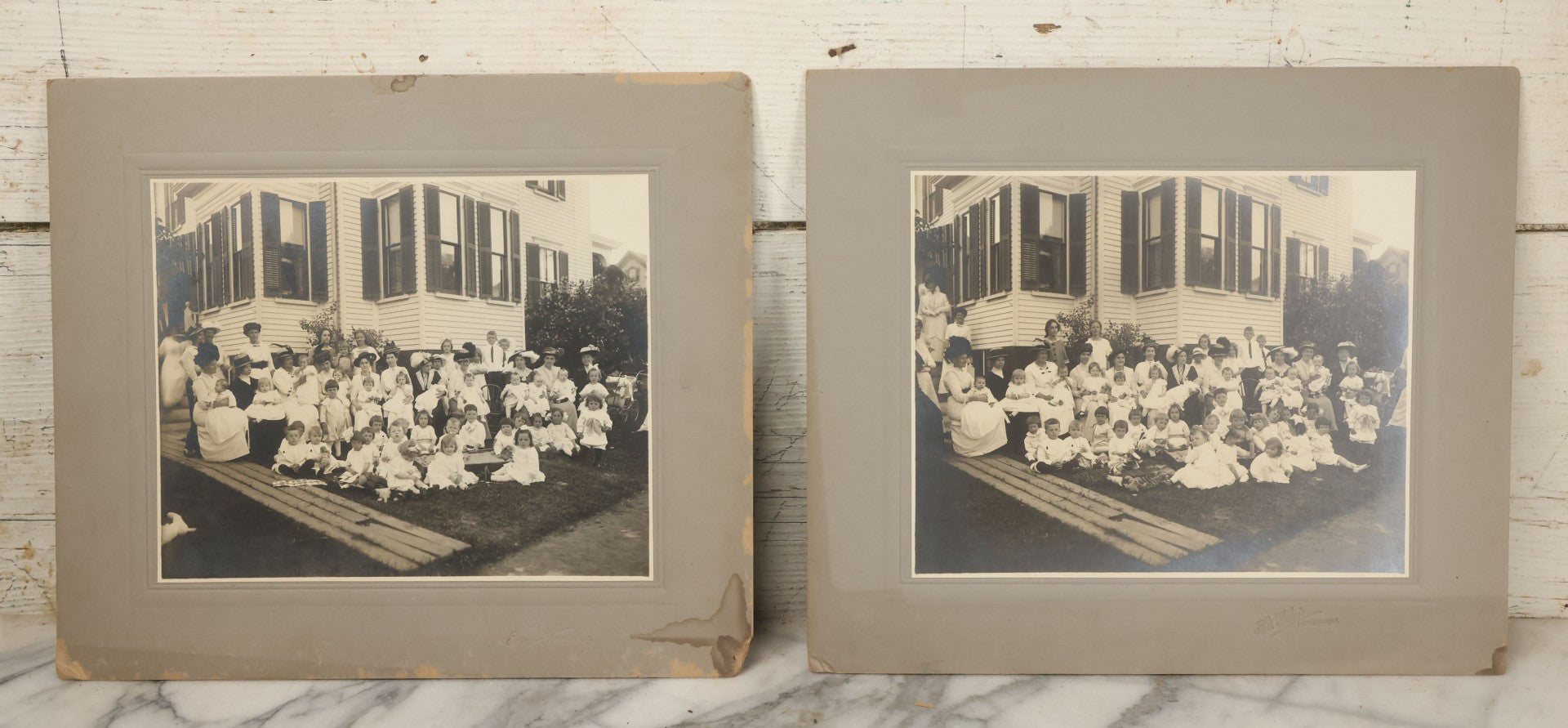 Lot 063 - Pair Of Antique Boarded Photographs Of Mothers And Their Toddlers Posing In Front Of A Home