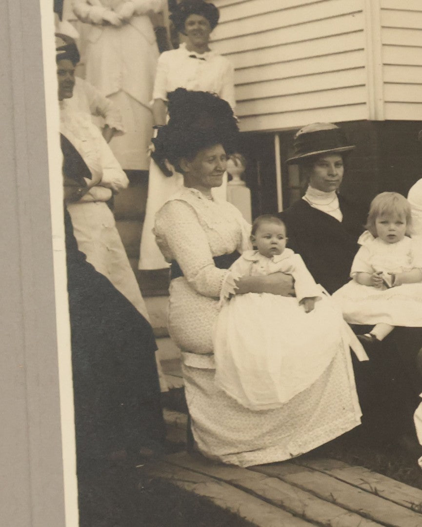 Lot 063 - Pair Of Antique Boarded Photographs Of Mothers And Their Toddlers Posing In Front Of A Home