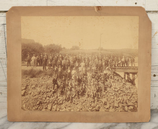 Lot 064 - Antique Photograph Of A Large Group Of Men Posing Next To The Dover Point Trestle Railroad Train Bridge, Dover, New Hampshire, With Detailed Identification On Verso, 1892