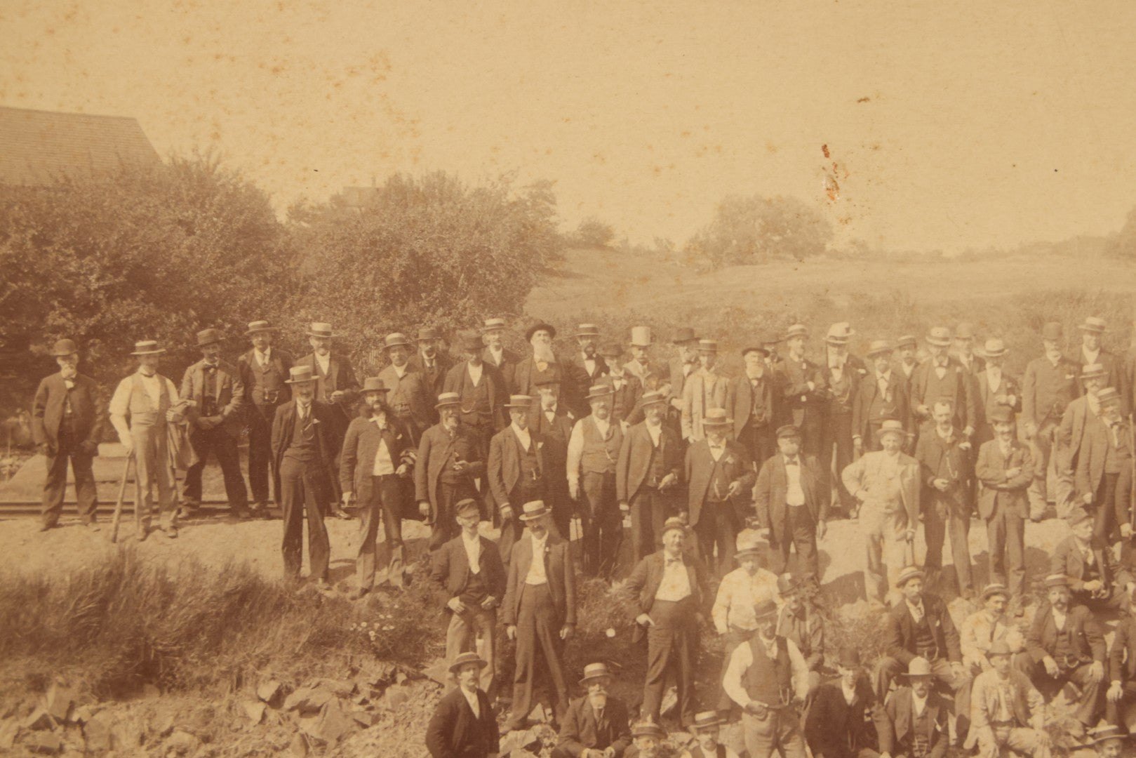 Lot 064 - Antique Photograph Of A Large Group Of Men Posing Next To The Dover Point Trestle Railroad Train Bridge, Dover, New Hampshire, With Detailed Identification On Verso, 1892