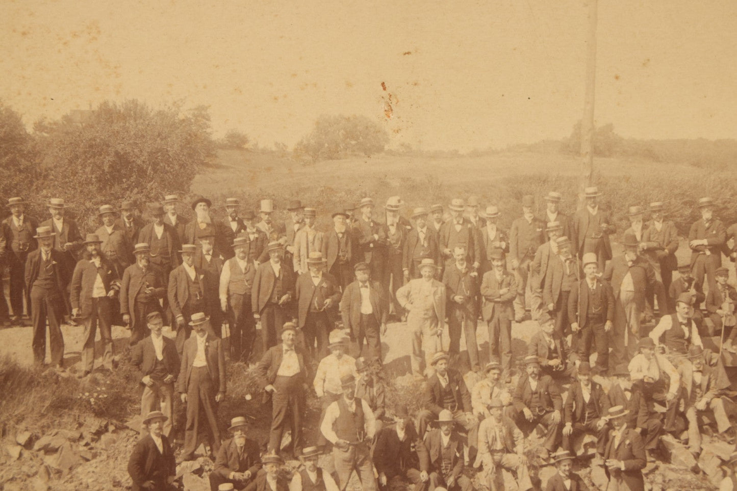 Lot 064 - Antique Photograph Of A Large Group Of Men Posing Next To The Dover Point Trestle Railroad Train Bridge, Dover, New Hampshire, With Detailed Identification On Verso, 1892