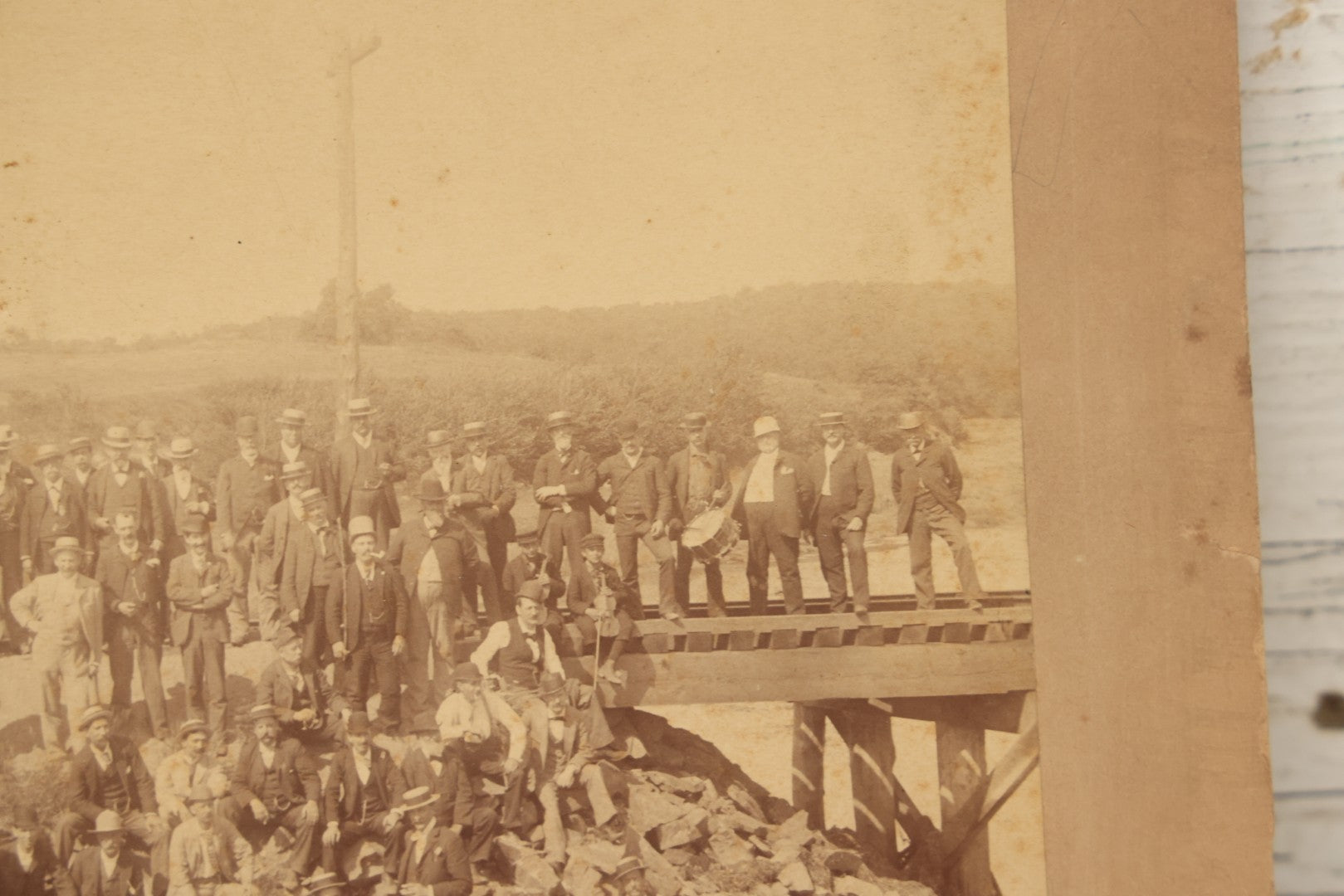 Lot 064 - Antique Photograph Of A Large Group Of Men Posing Next To The Dover Point Trestle Railroad Train Bridge, Dover, New Hampshire, With Detailed Identification On Verso, 1892