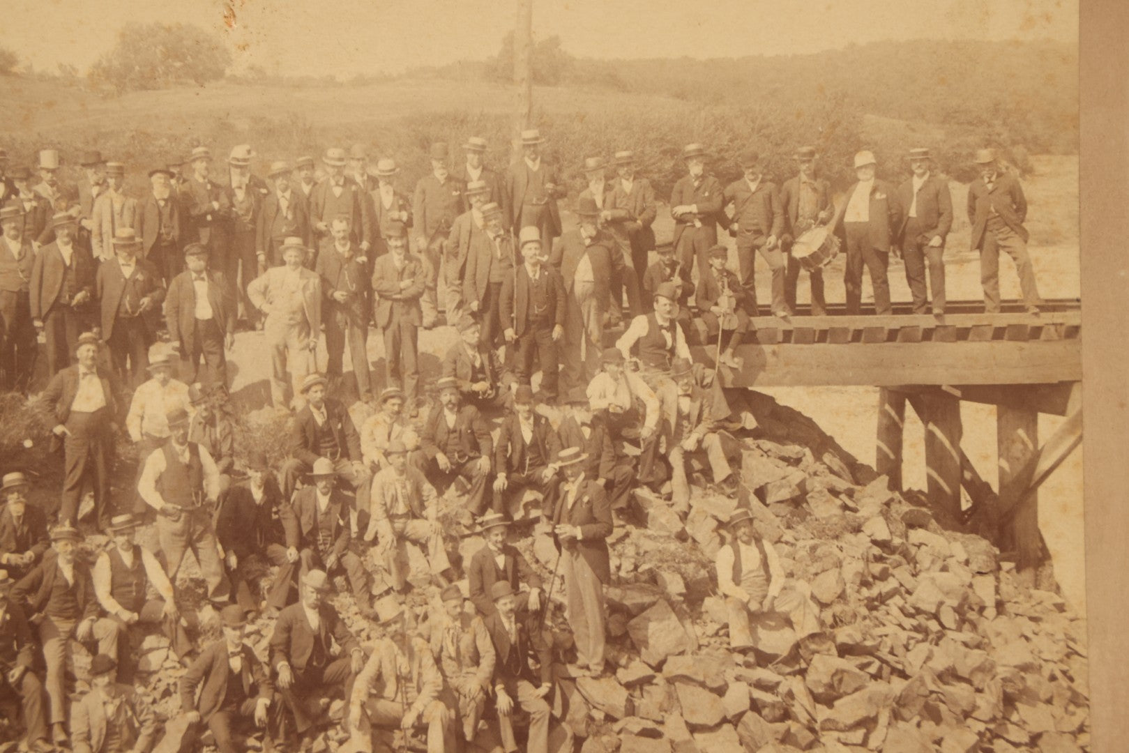 Lot 064 - Antique Photograph Of A Large Group Of Men Posing Next To The Dover Point Trestle Railroad Train Bridge, Dover, New Hampshire, With Detailed Identification On Verso, 1892