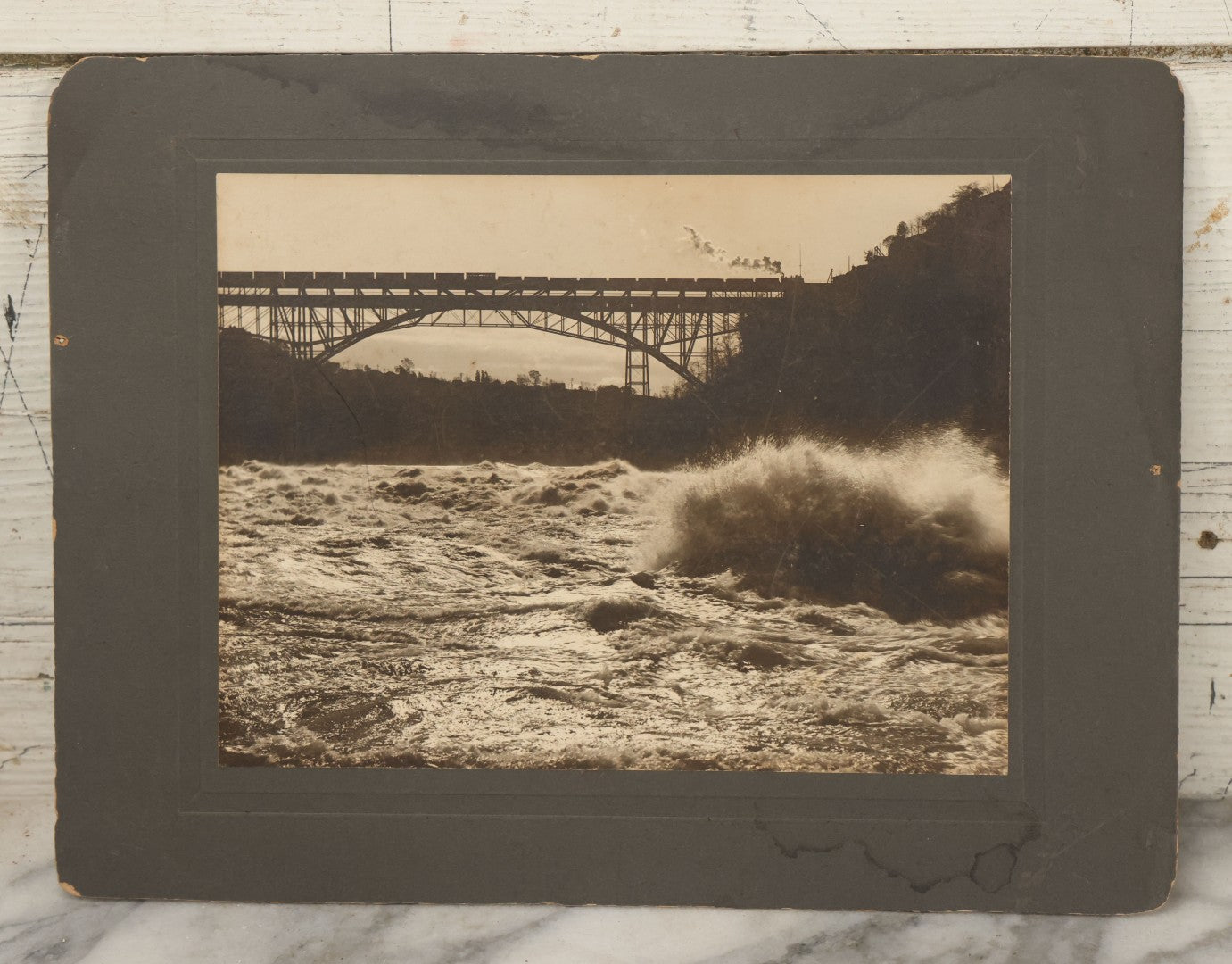 Lot 066 - Antique Boarded Photograph Of A Train Crossing The Whirlpool Rapids Bridge Between The United States And Canada, Niagara Falls