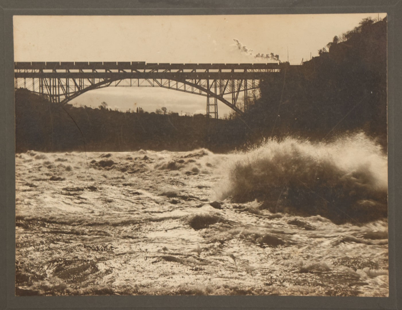 Lot 066 - Antique Boarded Photograph Of A Train Crossing The Whirlpool Rapids Bridge Between The United States And Canada, Niagara Falls