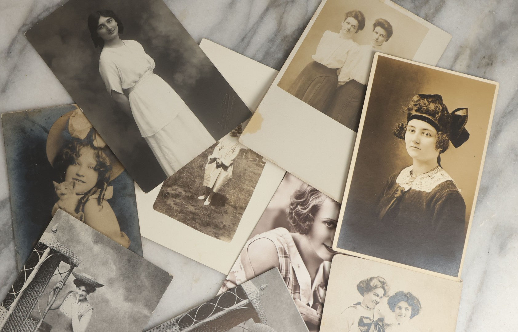 Lot 081 - Grouping Of Ten Antique And Vintage Photographic Postcards Of Women Including Girl With Cats, Woman In Costume, And Woman In Swimsuit, Etc., (Grouping A)