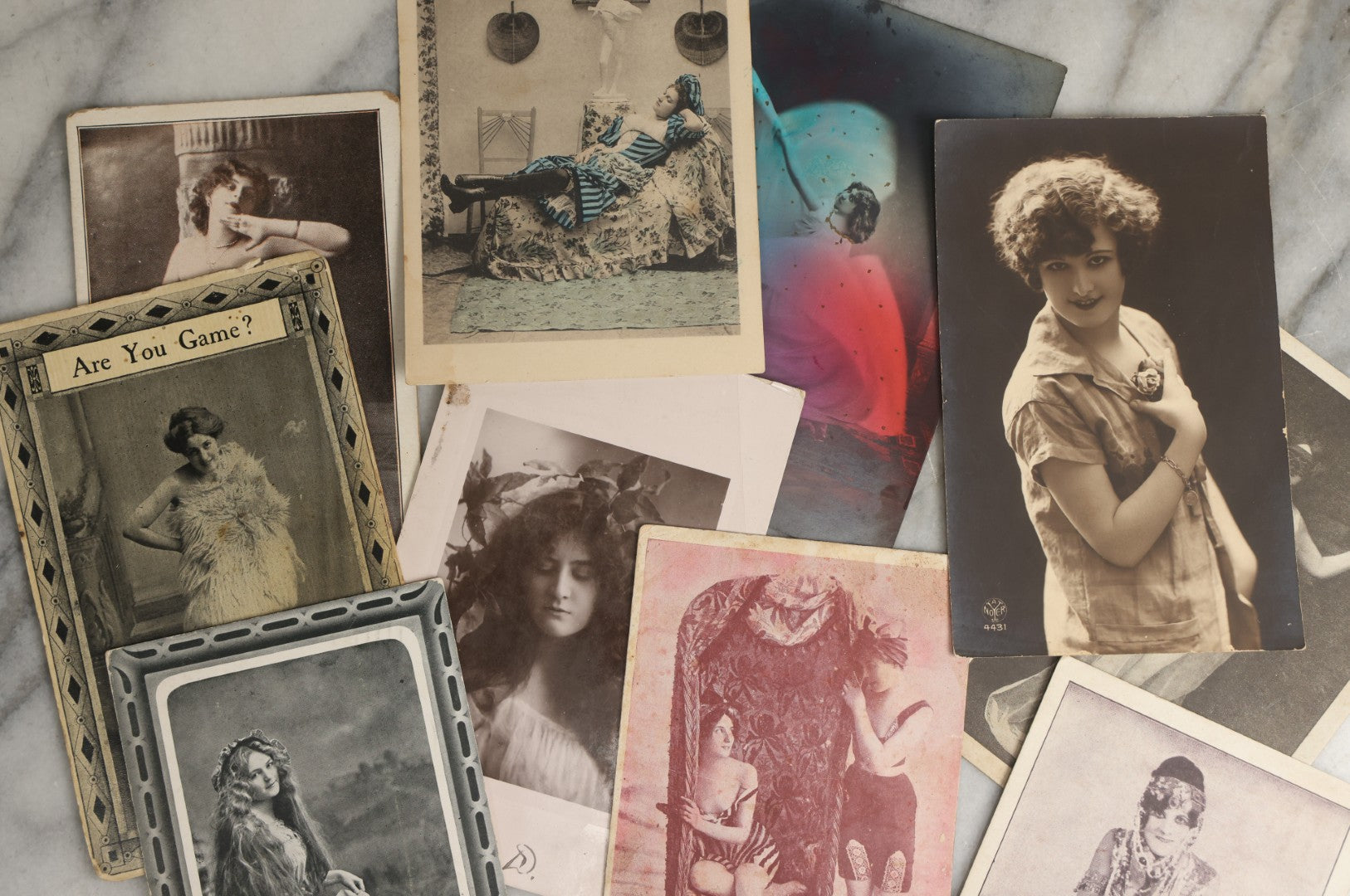 Lot 082 - Grouping Of Ten Antique And Vintage Photographic Postcards Of Women Including Gypsy Woman, Woman In Mask, "Are You Game," Etc., (Grouping B)