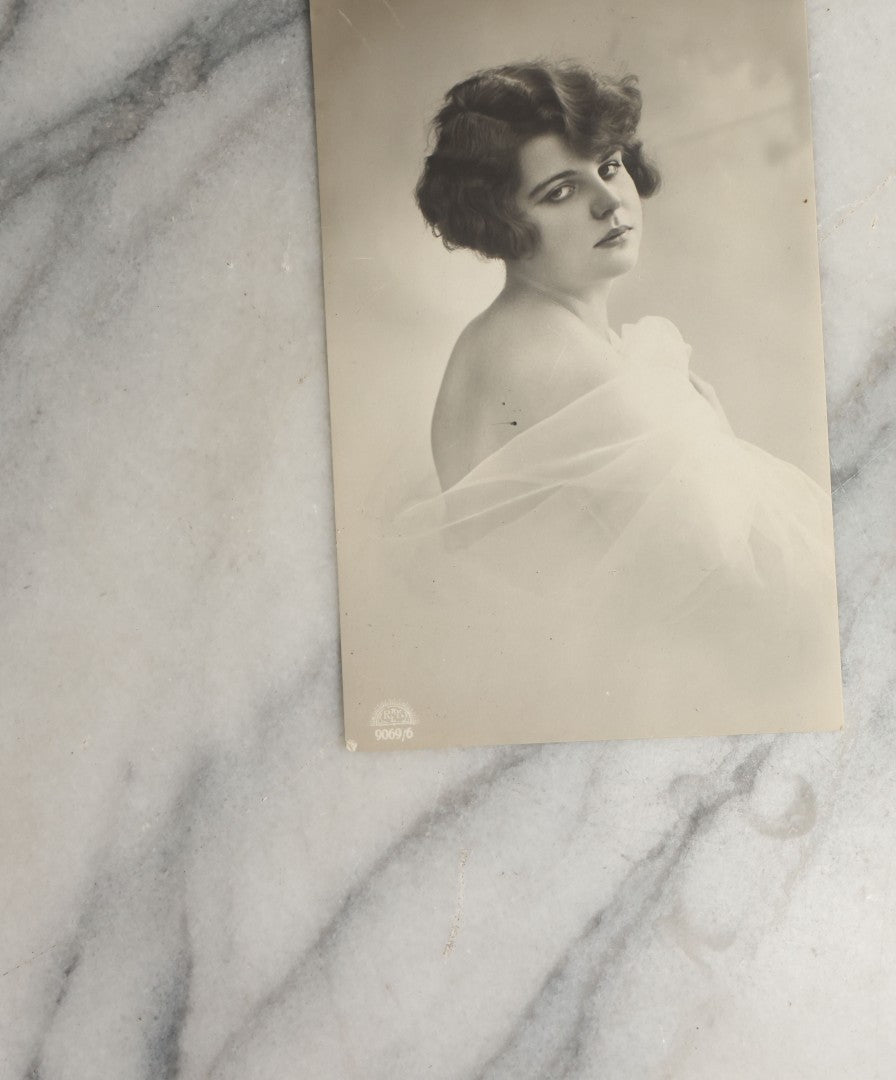 Lot 083 - Grouping Of Ten Antique And Vintage Photographic Postcards Of Women Including Cards With Green Tint, Girl With Flower In Her Hair, Etc., (Grouping C)