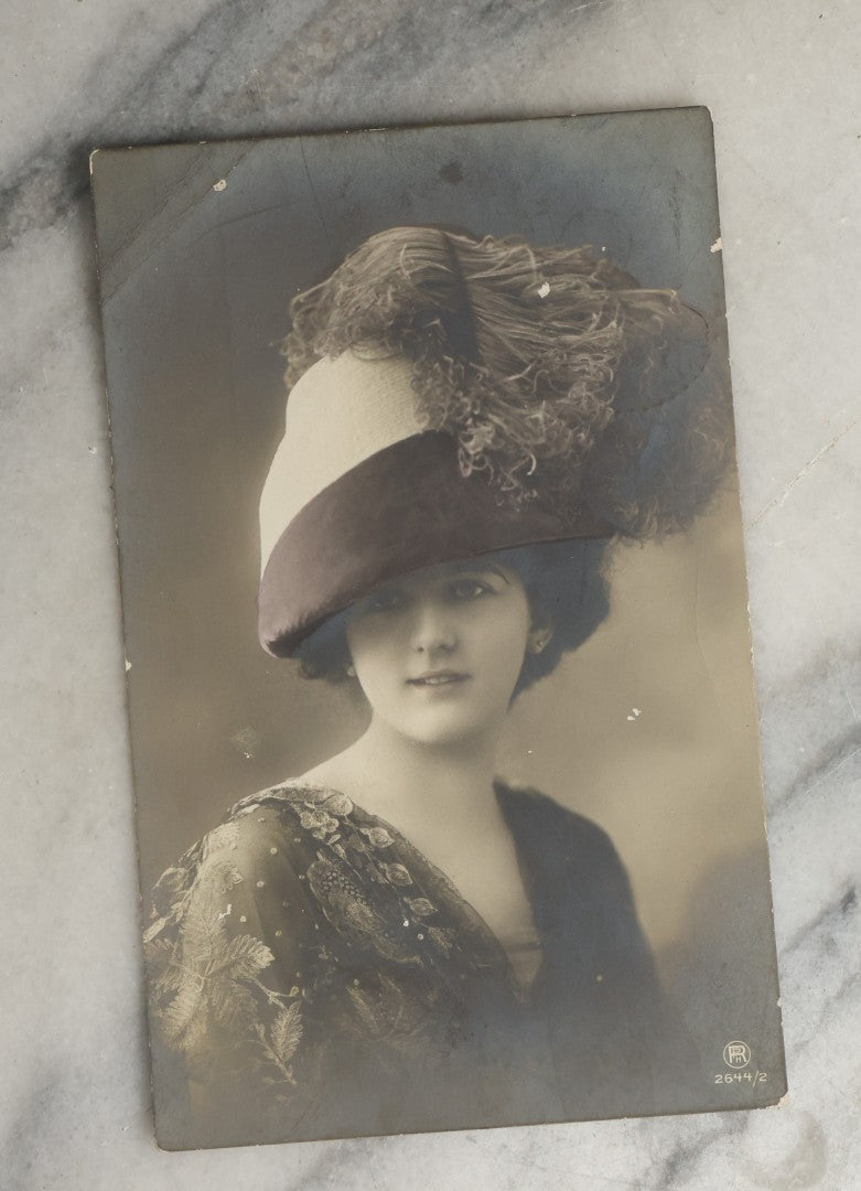 Lot 084 - Grouping Of Ten Antique And Vintage Photographic Postcards Of Women Including Woman In Garbage Pail Hat, French Beauty, "Hurry And Join Me," Etc., (Grouping D)