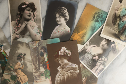 Lot 085 - Grouping Of Ten Antique And Vintage Photographic Postcards Of Women Including Many With Hand Coloring, Tinting, Woman With Large Bow In Hair, Etc., (Grouping E)