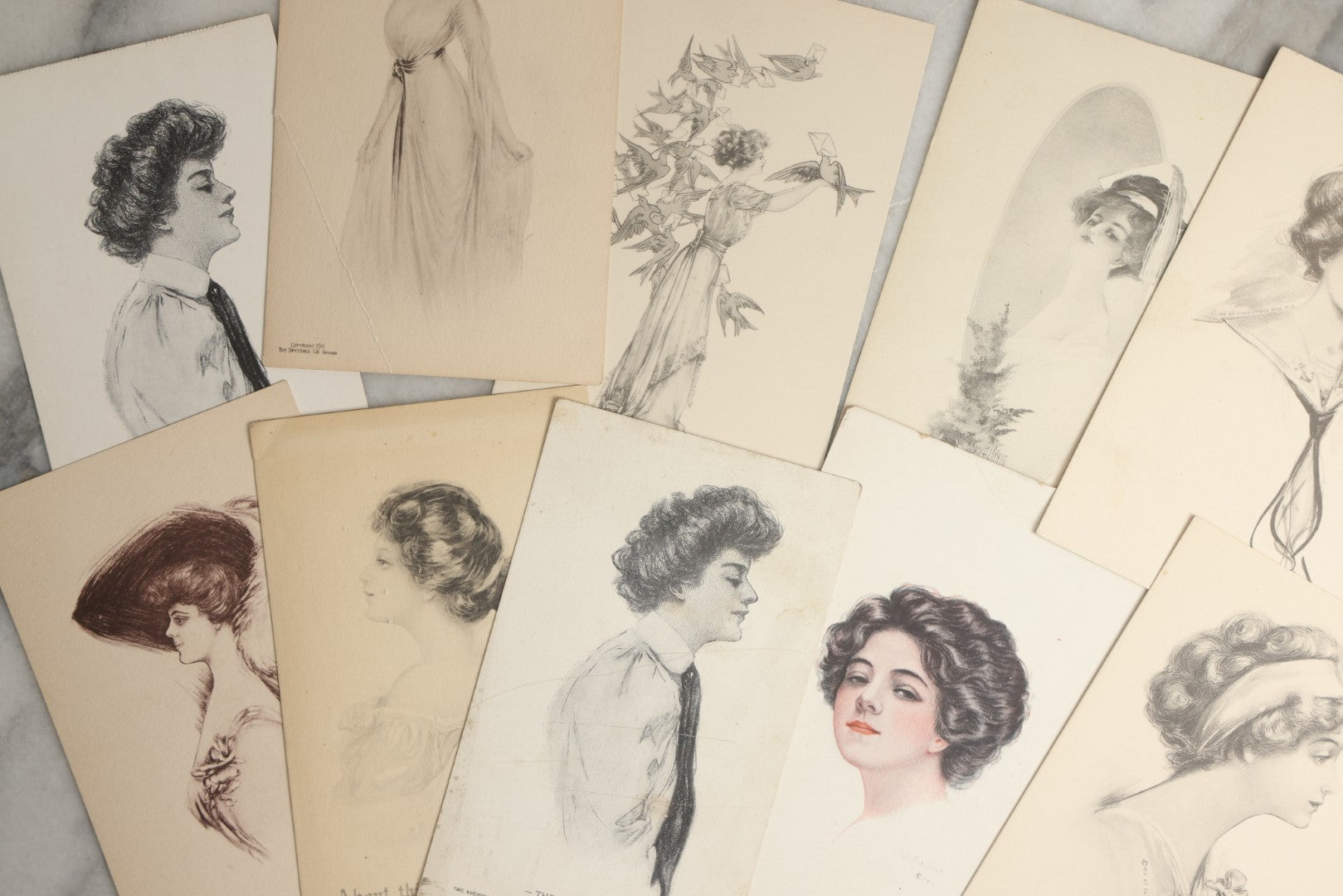 Lot 089 - Grouping Of Ten Antique And Vintage Illustrated Postcards Of Women Including Graduate, Girl With Birds, John Cecil Clay Girl, Etc., (Grouping I)