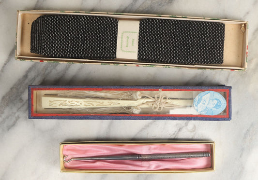 Lot 108 - Grouping Of Three Boxed Ladies Dresser Items Including Corset Hook, Hand Fan, And Xmas Greetings Textile