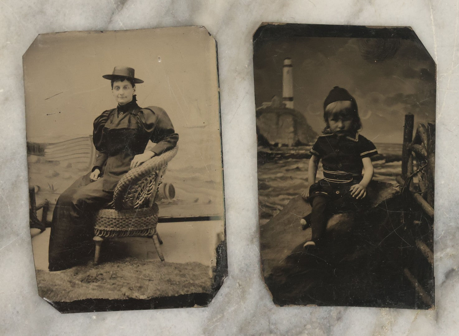 Lot 154 - Pair Of Antique Tintype Photographs Of People Posing In Front Of Beach Themed Backdrop, Woman And Child