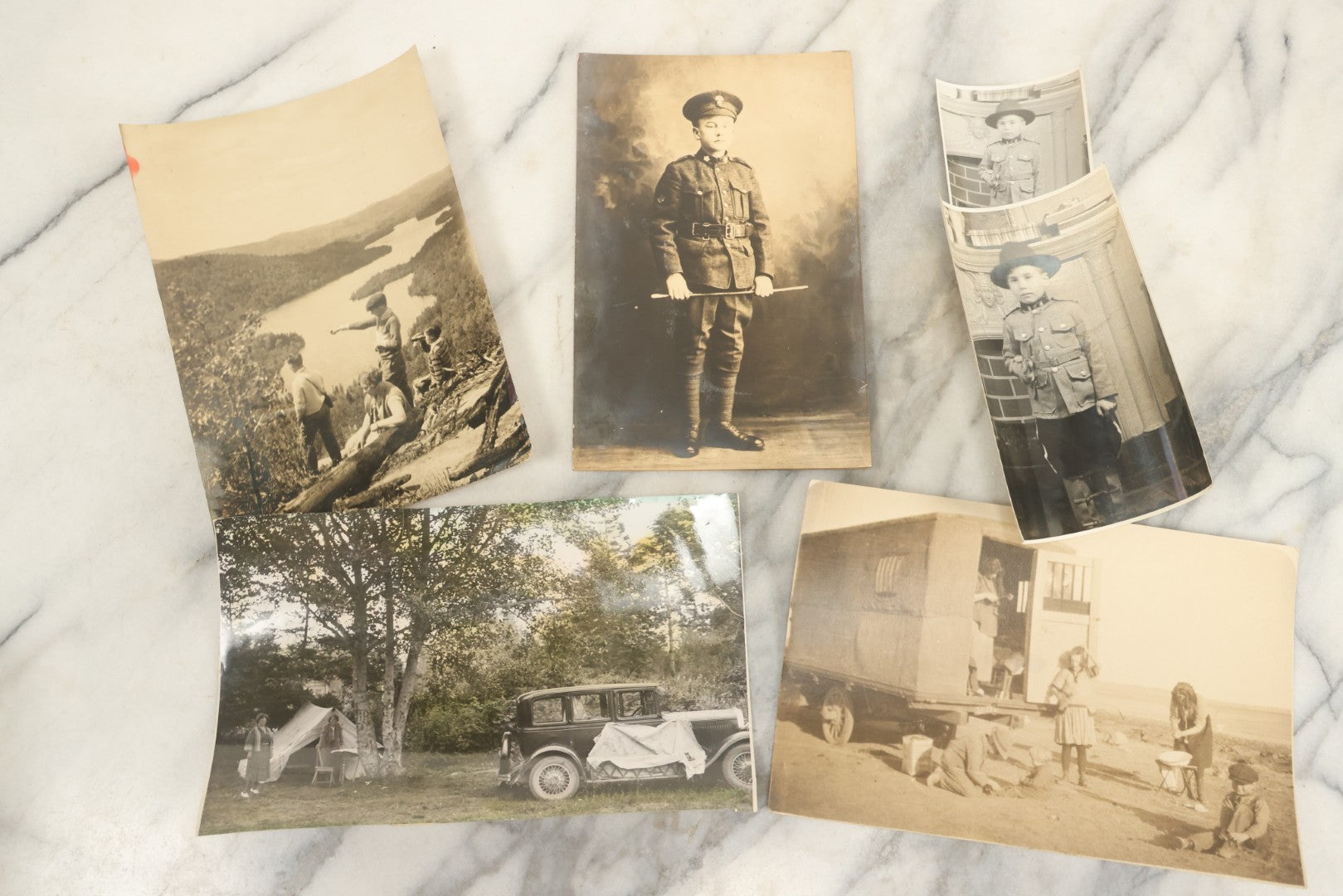 Lot 162 - Grouping Of 6 Snapshot And Other Photos Of Boy In Uniform, Camping Trip, People By Lake, People Behind Wagon