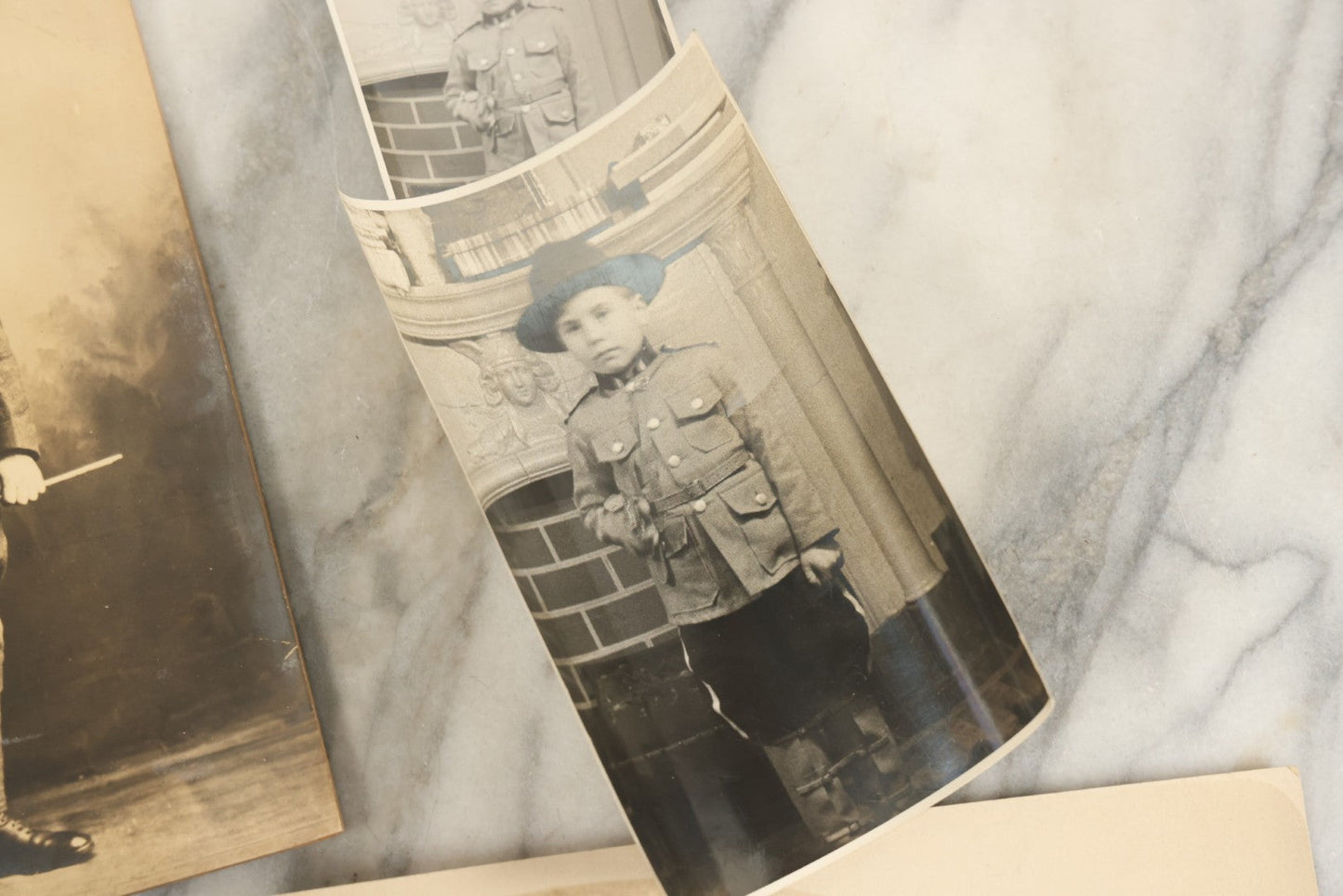 Lot 162 - Grouping Of 6 Snapshot And Other Photos Of Boy In Uniform, Camping Trip, People By Lake, People Behind Wagon