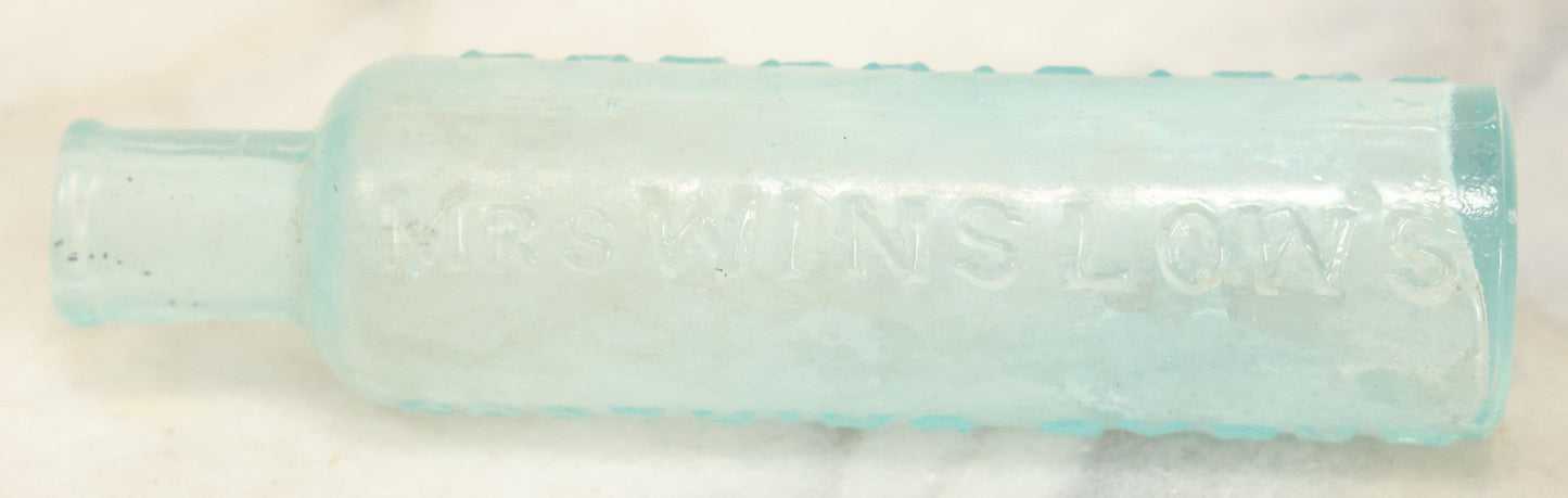 Lot 024 - Antique Mrs. Winslow's Soothing Syrup Medicine Bottle, Curtis & Perkins, Proprietors
