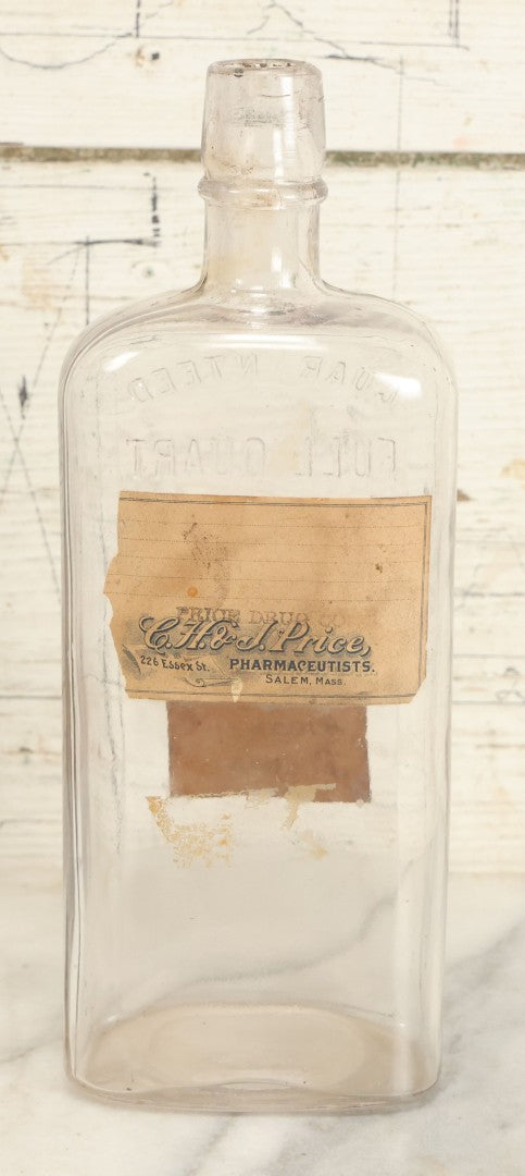 Lot 028 - Antique Glass Pharmacy Bottle From C.H. & J, Price, Pharmacists, Salem, Massachusetts, With Handwritten "Denatured Alcohol Poison" Label And Red Poison Label With Skull And Crossbones, Full Quart Size