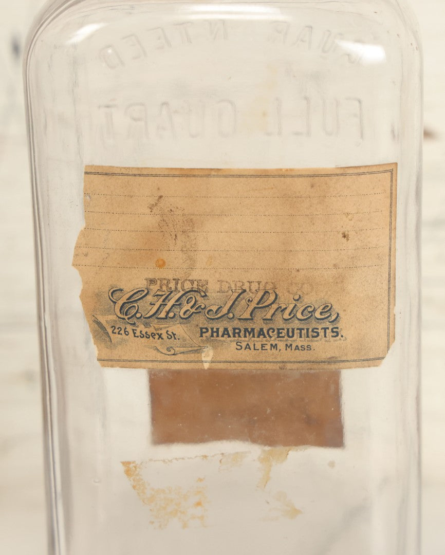 Lot 028 - Antique Glass Pharmacy Bottle From C.H. & J, Price, Pharmacists, Salem, Massachusetts, With Handwritten "Denatured Alcohol Poison" Label And Red Poison Label With Skull And Crossbones, Full Quart Size