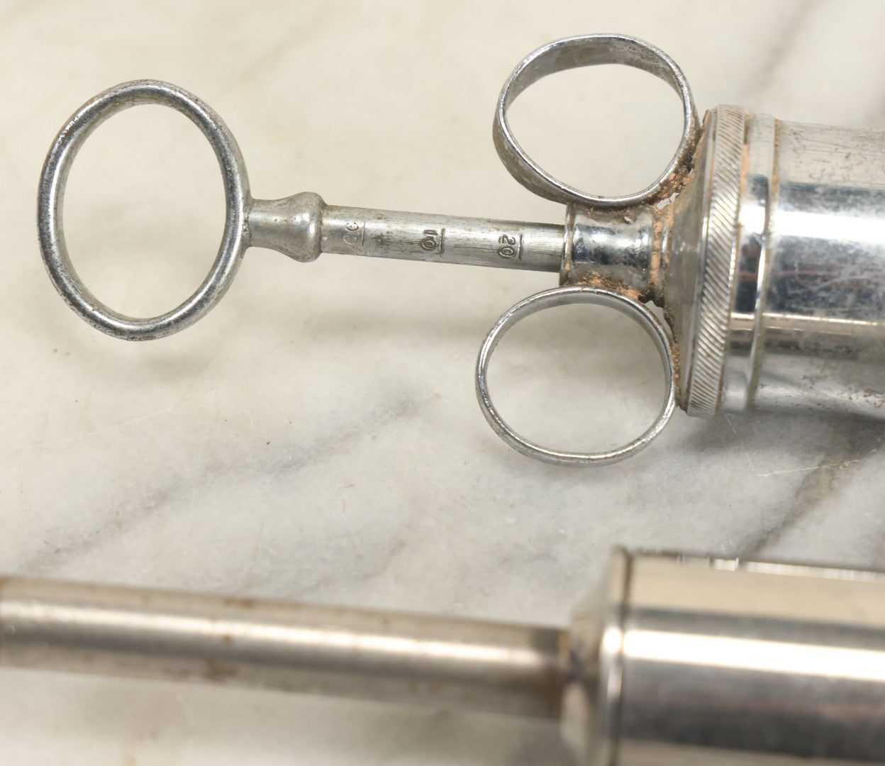 Lot 038 - Pair Of Antique Metal Syringes Including Empire By Becton, Dickinson, & Co., Rutherford, New Jersey