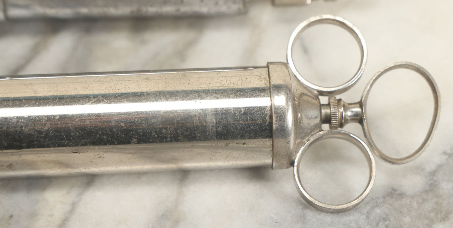 Lot 038 - Pair Of Antique Metal Syringes Including Empire By Becton, Dickinson, & Co., Rutherford, New Jersey