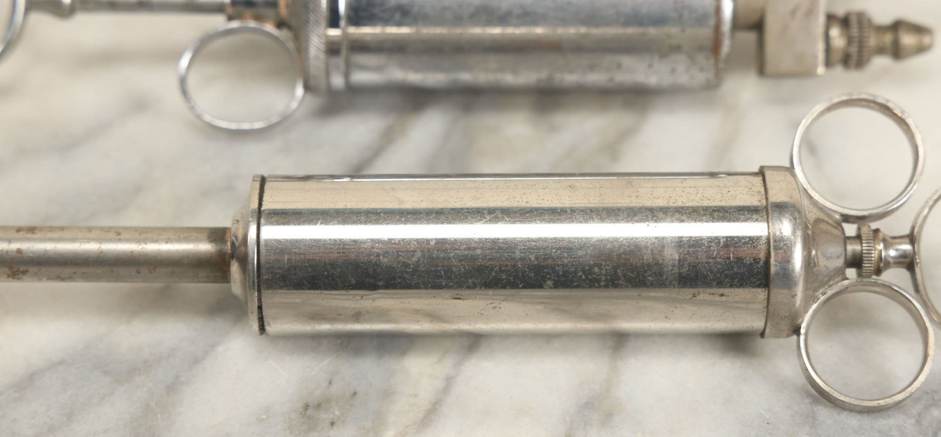 Lot 038 - Pair Of Antique Metal Syringes Including Empire By Becton, Dickinson, & Co., Rutherford, New Jersey