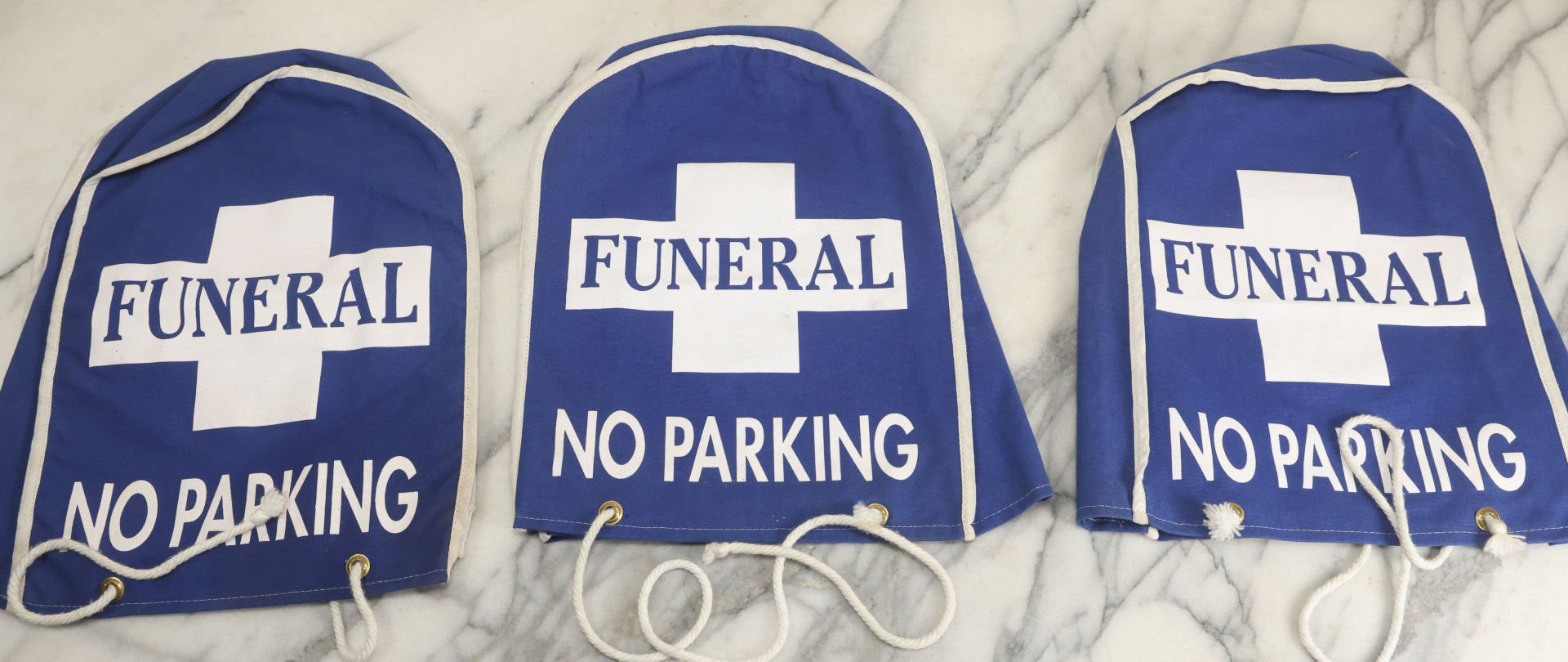 Lot 044 - Grouping Of Three Modern Blue Canvas Funeral Home No Parking Meter Covers