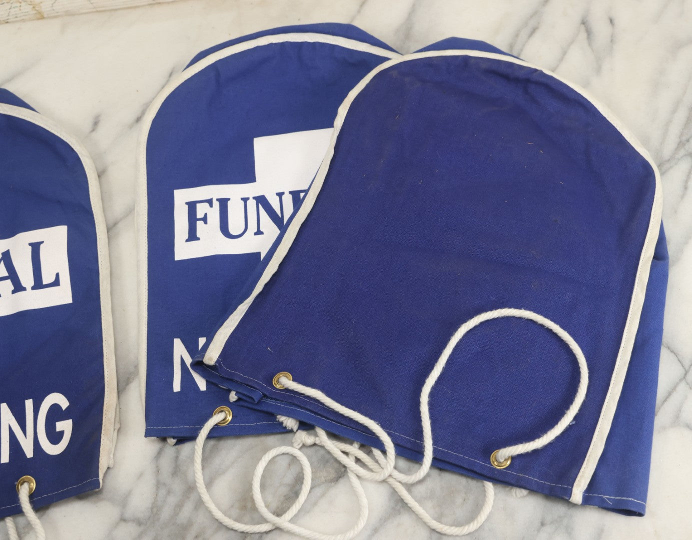 Lot 044 - Grouping Of Three Modern Blue Canvas Funeral Home No Parking Meter Covers