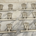 Lot 050 - Grouping Of Six New Old Stock N.O.S. Tin Metal Decorative Funeral Casket Handles