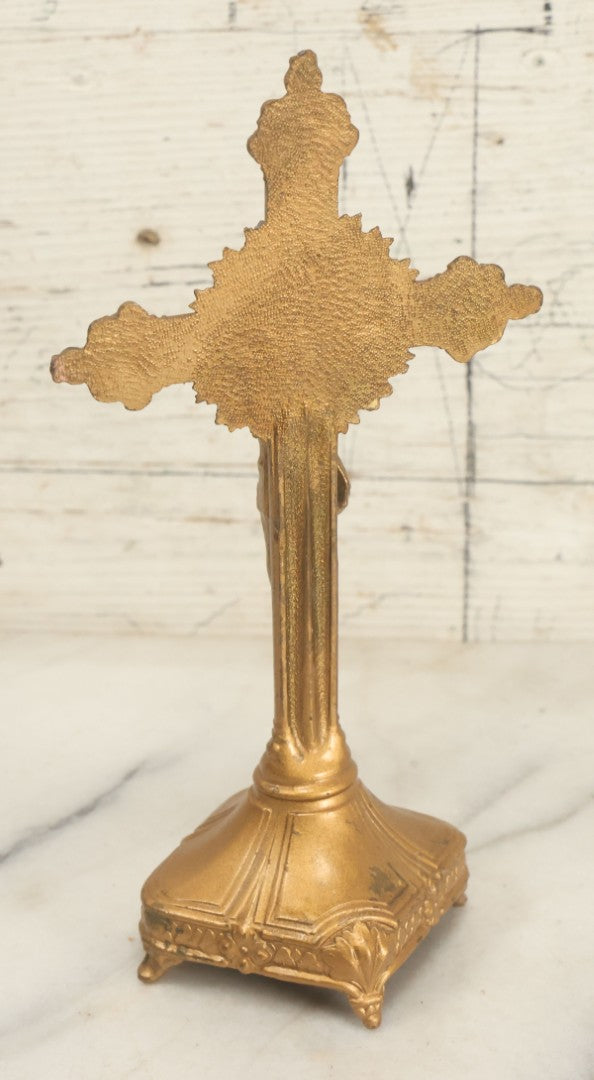 Lot 059 - Pair Of Cast Metal Gold Painted Crucifixes, One Free Standing On Base, One Wall Hanging