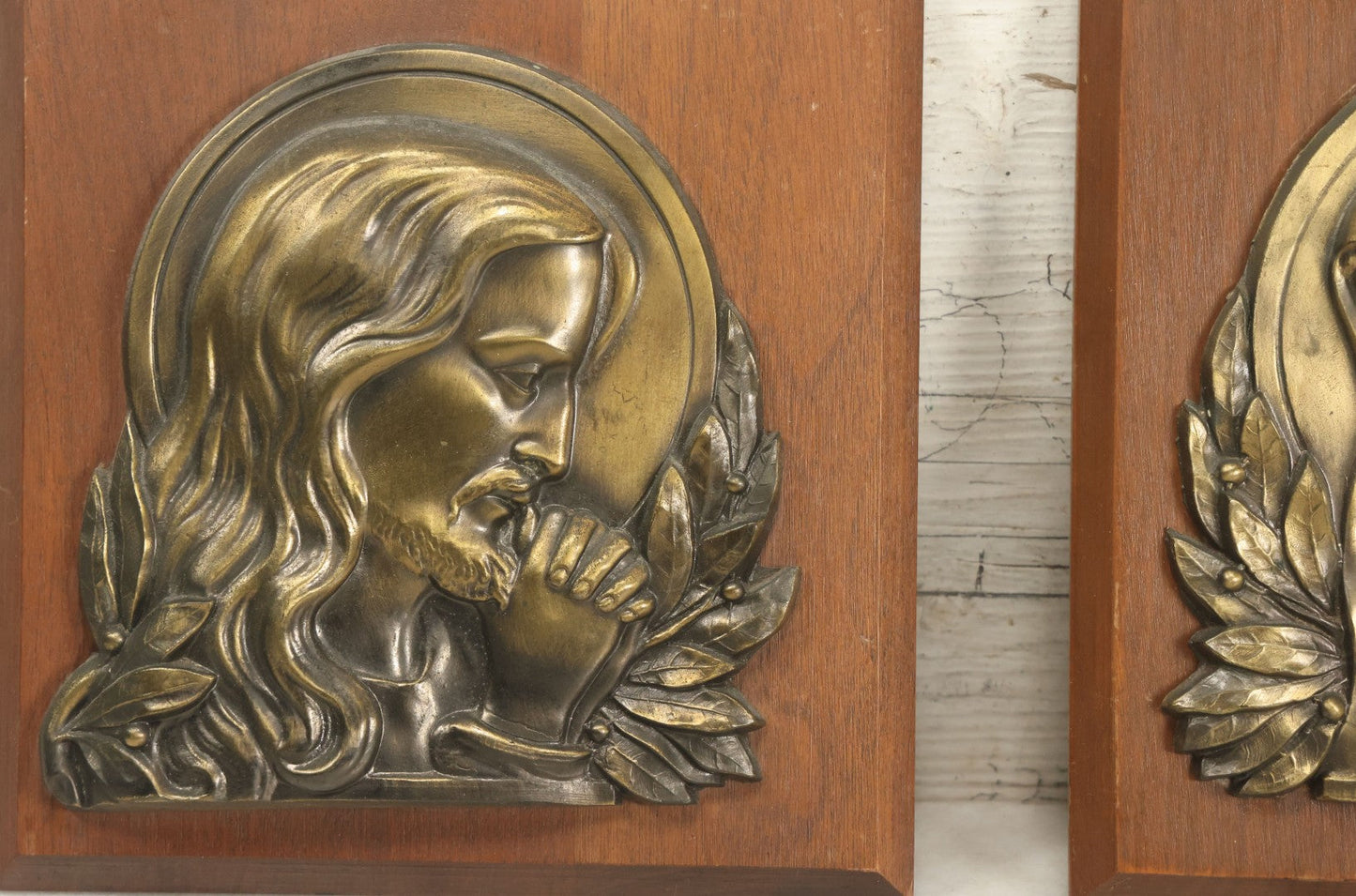 Lot 068 - Pair Of Cast Metal Religious Decor Plaques With Jesus Christ And The Virgin Mary, Mounted To Wood Panel