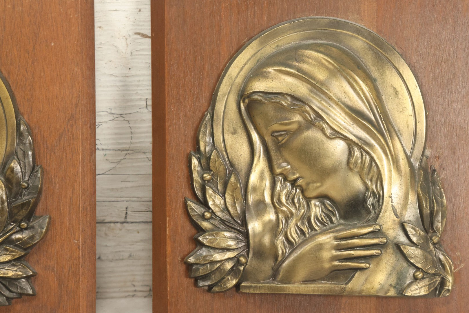Lot 068 - Pair Of Cast Metal Religious Decor Plaques With Jesus Christ And The Virgin Mary, Mounted To Wood Panel