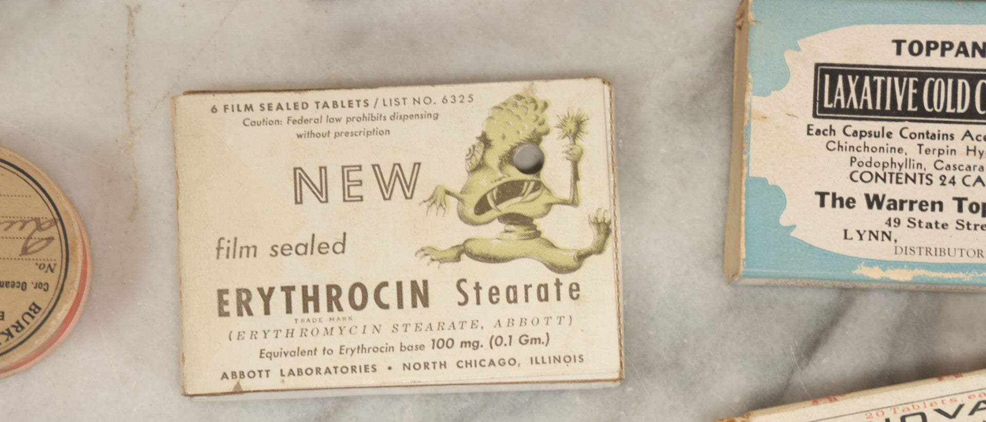Lot 074 - Grouping Of 18 Boxed Pharmacy Items Including Ideal Syringe, Toppan's Laxative Cold Capsules, Mearig Throat Lozenges, And More